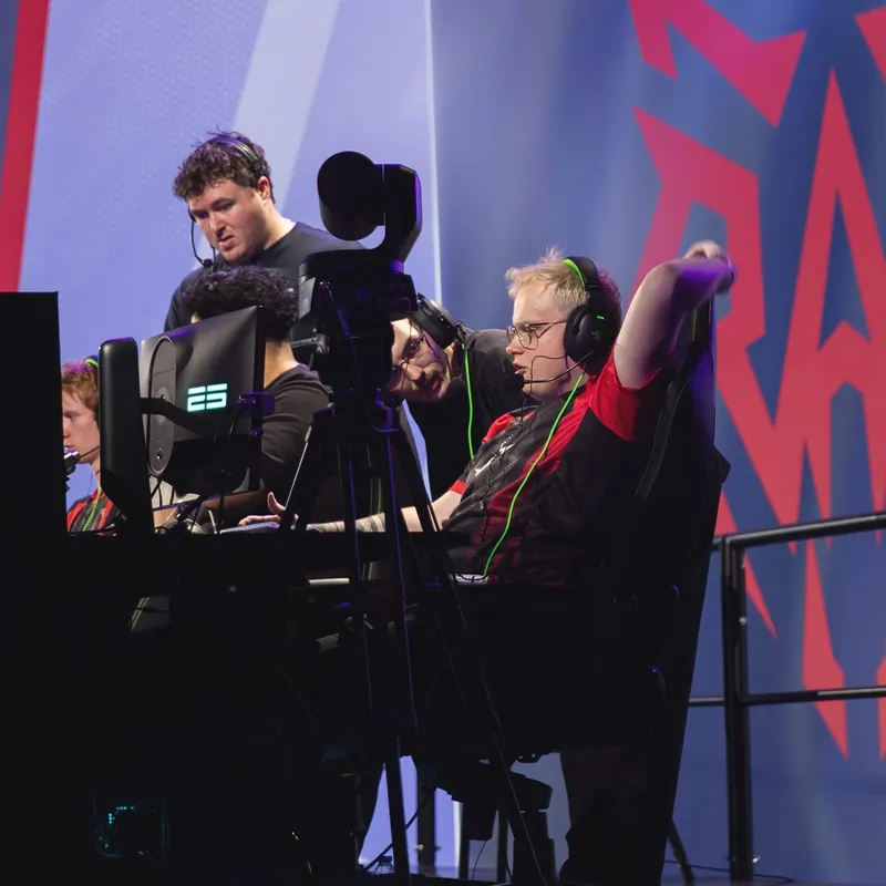 Denis coaching a RAD player on the bench