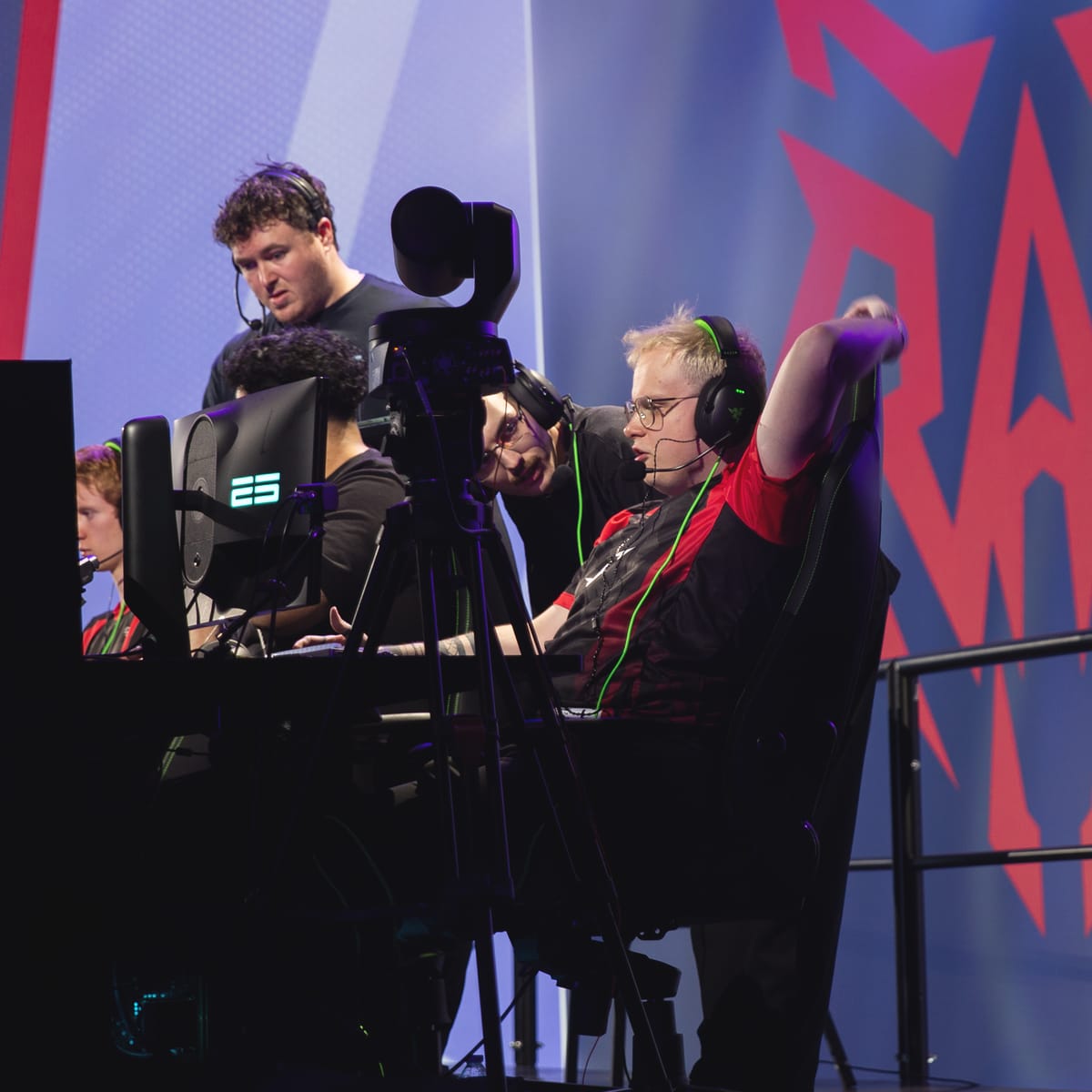 Denis coaching a RAD player on the bench